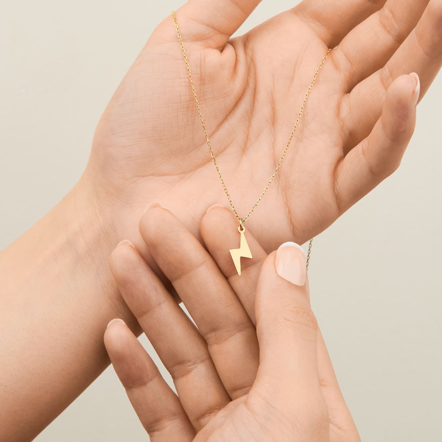 14K gold lightning pendant