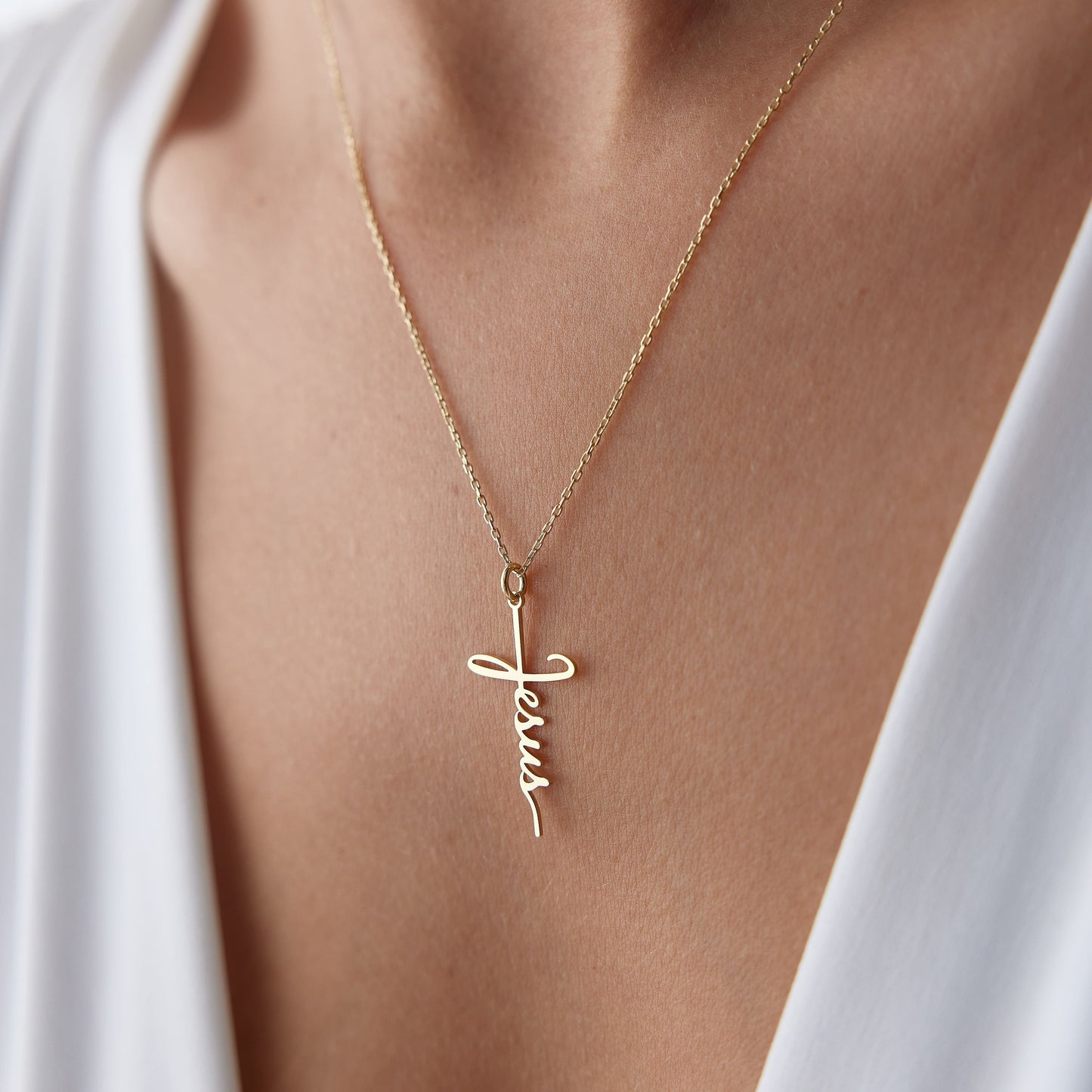 solid gold cross necklace with Jesus inscription