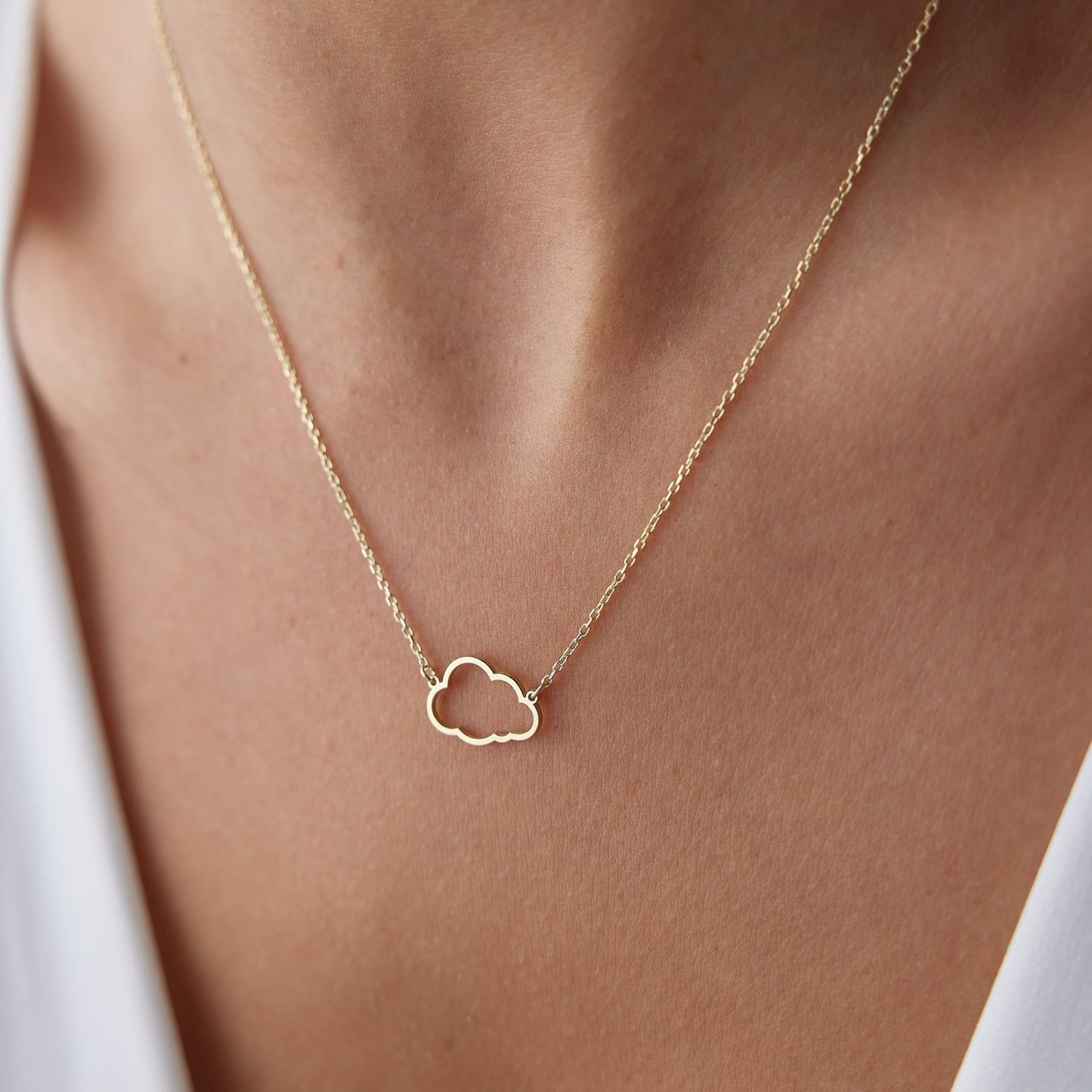 tiny cloud necklace in yellow gold