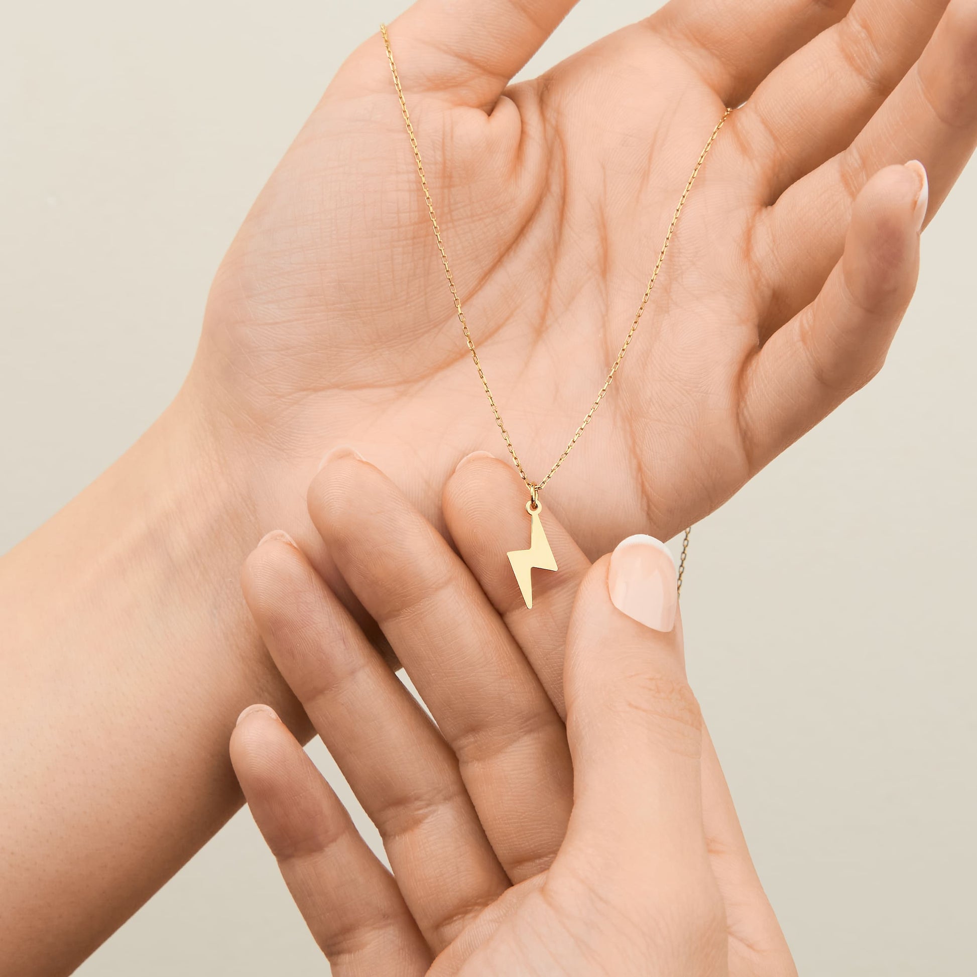 14K gold lightning pendant