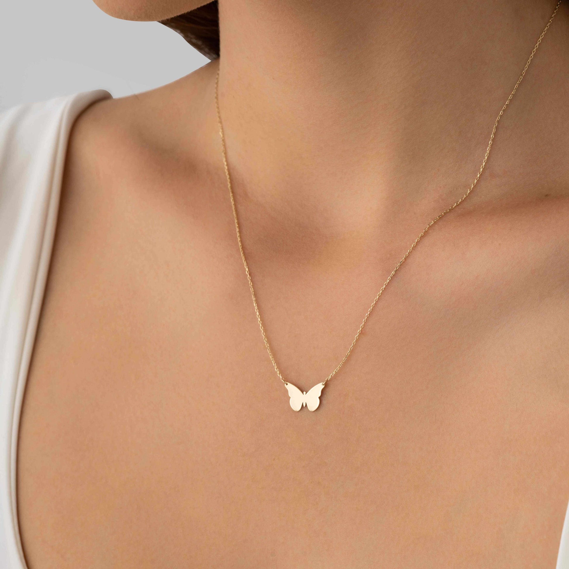 Gold butterfly pendant – symbol of grace and resilience