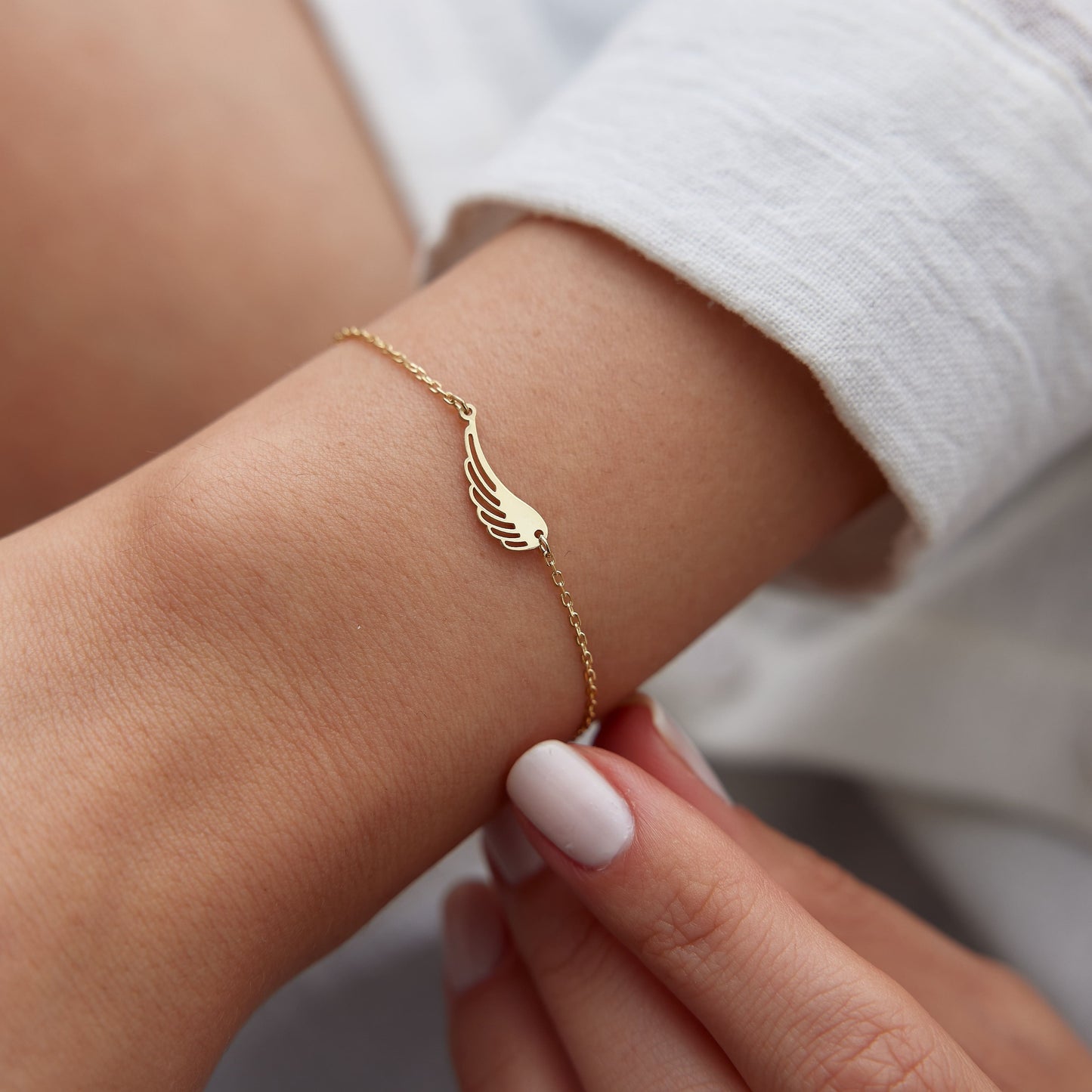 14K Gold Angel Wing Bracelet – Symbol of Protection & Guidance