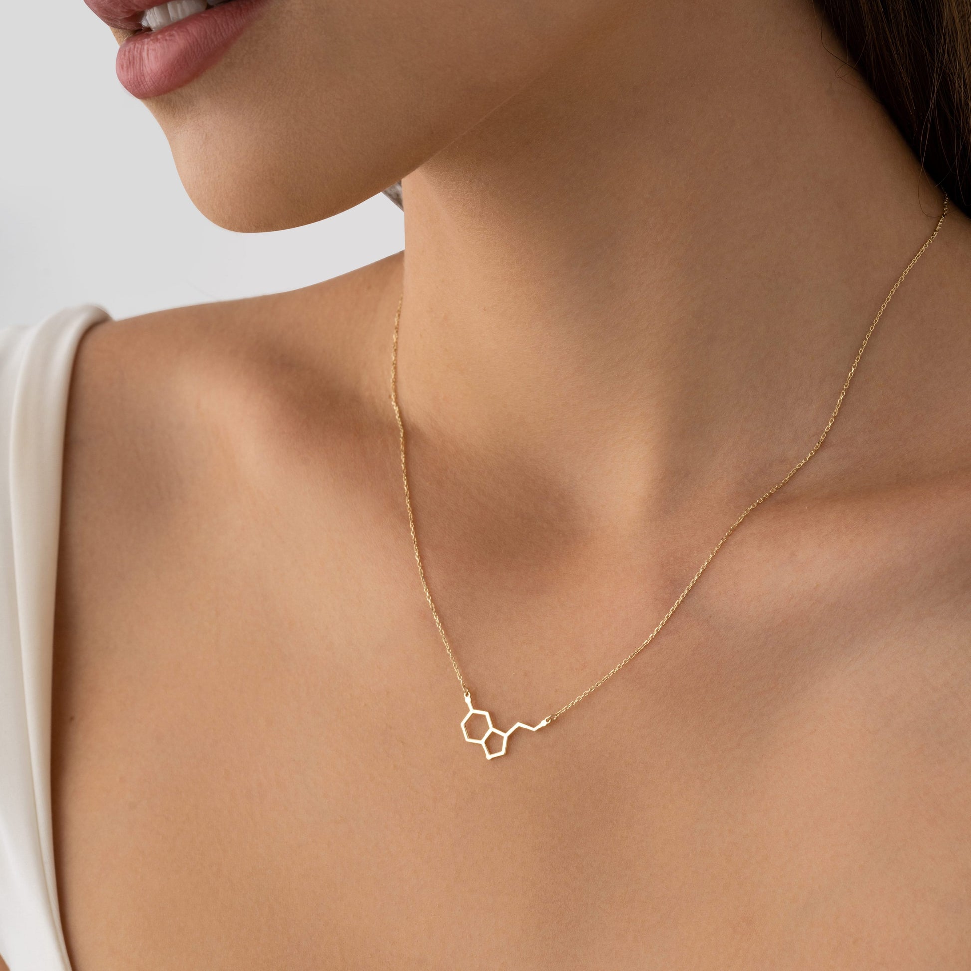 minimalist science jewelry in solid gold