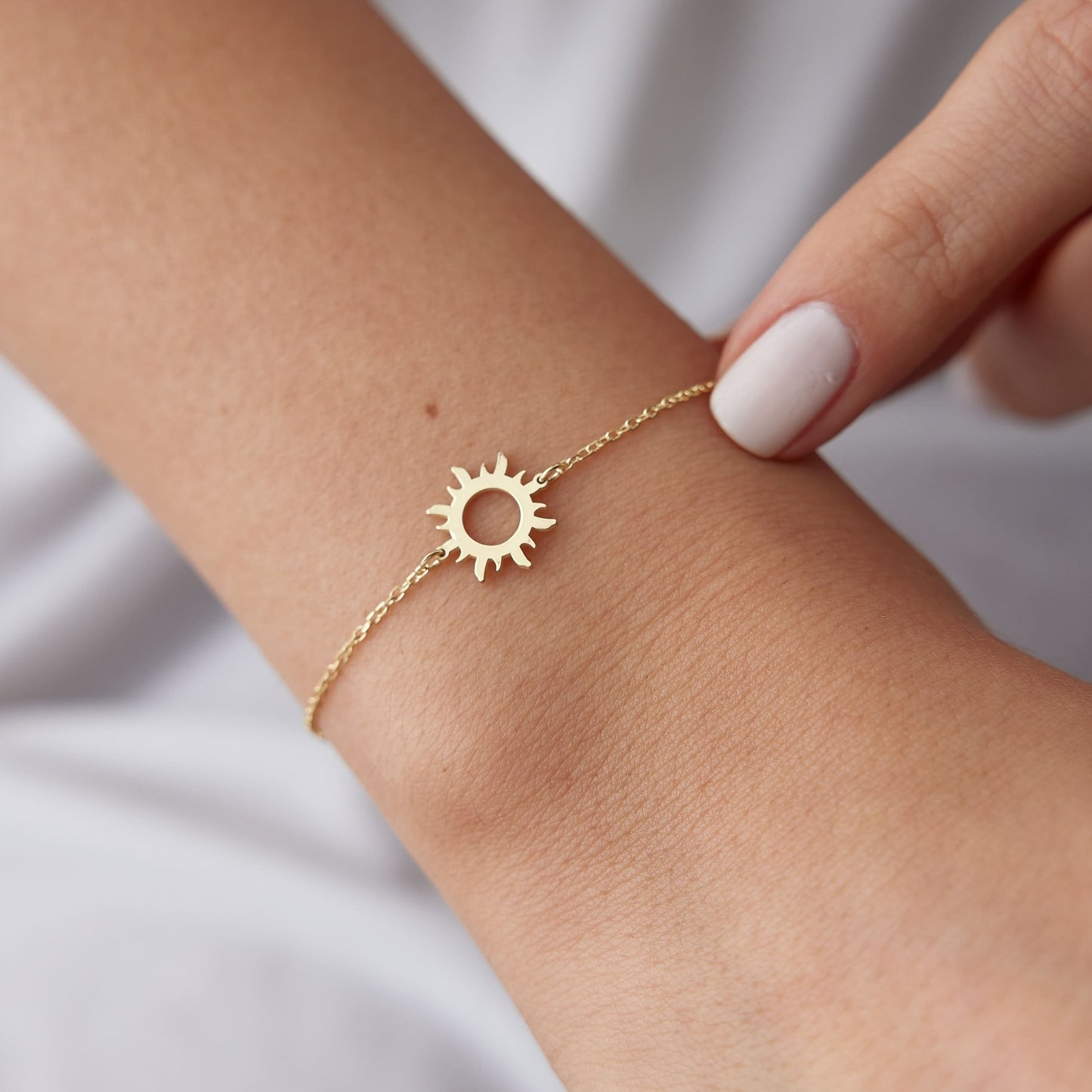 gold bracelet symbolizing light and positivity