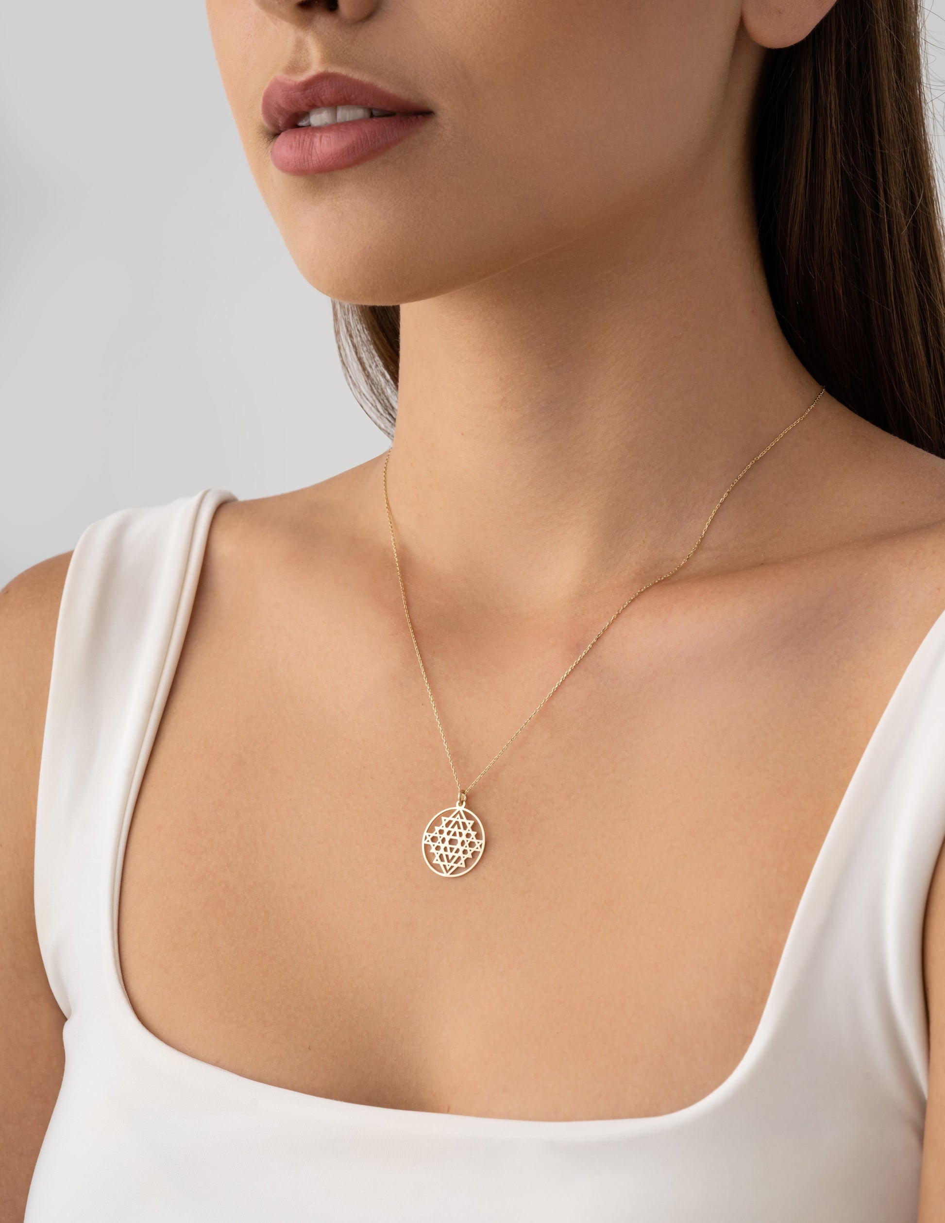 spiritual meditation charm in gold